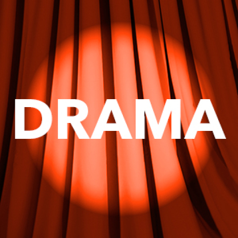 DRAMA in front of red curtain
